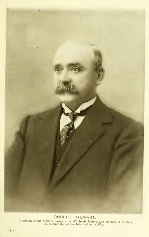 b&w studio bust portrait c.1920 of a balding man with a heavy mustache wearing a dark suit
