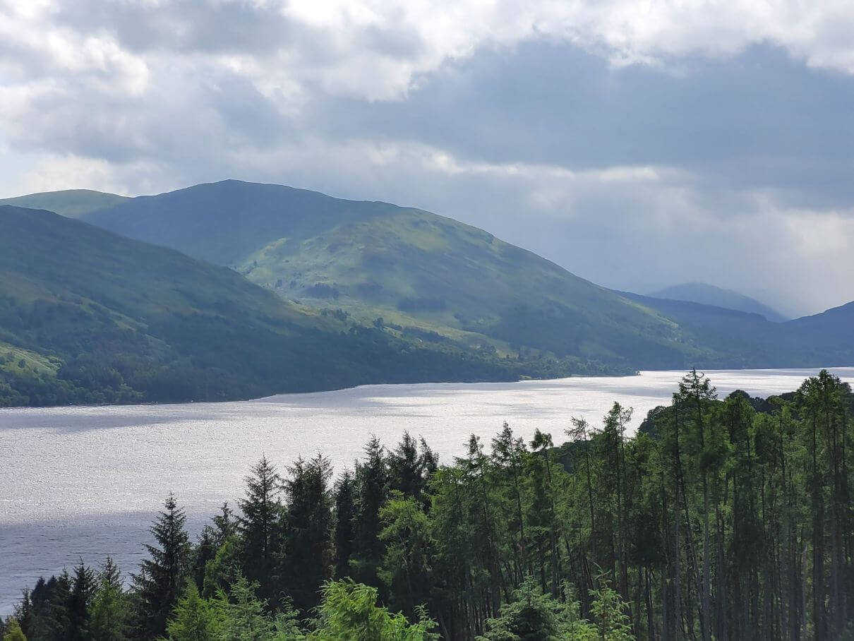 Highland loch viewed from up on a hillside on a partly cloudy day